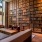 a room with a large bookcase and a couch