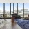 a living room with a view of the city
