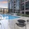 a pool and chairs outside a building