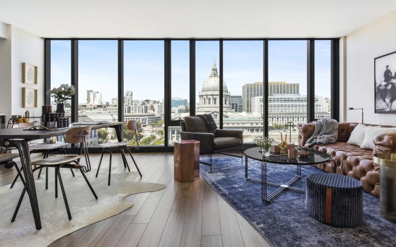 a living room with a view of the city