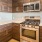 a kitchen with wooden cabinets