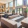 a room with a couch and chairs