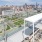 a rooftop of a building with a city in the background