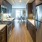 a kitchen with a refrigerator and stove