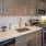 a kitchen with wooden cabinets